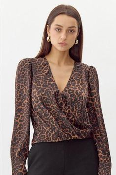 Take a walk on the wild side with our Paris Night top! Featuring a fierce cheetah print, this top will add a bold touch to any outfit. Embrace your inner wild child and make a statement with this unique and playful piece. (Rawr!) Night Tops, Walk On The Wild Side, Paris At Night, Take A Walk, Wild Child, Walk On, A Walk, Cheetah Print, The Wild