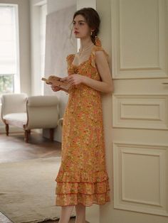 Color: OrangeStyle: BohoPattern Type: Floral, All Over PrintDetails: Tiered Layer, Ruffle Hem, KnotNeckline: SweetheartSleeve Length: SleevelessType: A LineWaist Line: High WaistHem Shaped: Layered/Tiered, FlounceLength: LongFit Type: Regular FitFabric: Non-StretchMaterial: PolyesterComposition: 100% PolyesterCare Instructions: Machine wash or professional dry cleanBody: YesSheer: NoLining: 100% Polyester