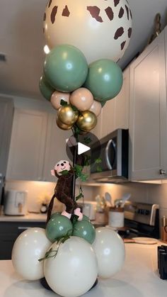 balloons are stacked on top of each other in the kitchen