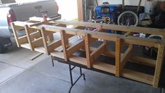 the back end of a truck with wooden shelves