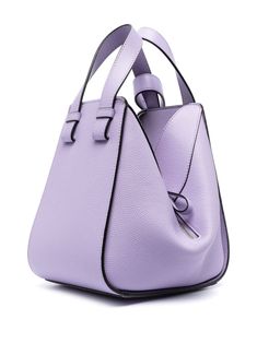 Compact Hammock grained leather tote bag from LOEWE featuring lilac purple, calf leather, grained texture, signature embossed Anagram motif, hook and eye fastening, adjustable detachable shoulder strap, two top handles, main compartment and internal slip This item is in size UNI and the color is Violet Modern Purple Top Handle Shoulder Bag, Modern Purple Leather Shoulder Bag, Purple Leather Satchel With Top Carry Handle, Purple Leather Shoulder Bag With Top Carry Handle, Modern Purple Bag With Detachable Strap, Modern Purple Leather Satchel, Purple Double Handle Satchel With Handle Drop, Purple Leather Shoulder Bag With Detachable Handle, Purple Leather Bags With Top Carry Handle