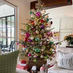 a decorated christmas tree in a living room