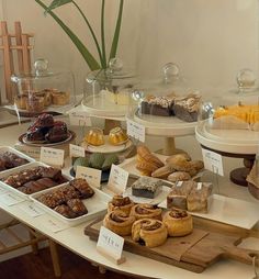 an assortment of pastries on display at a bakery