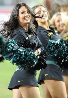 a group of cheerleaders perform on the field