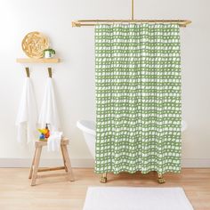 a bathroom with a white bathtub and wooden stools next to the shower curtain