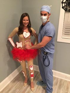 a man and woman dressed up as nurse and nurse with masks on posing for the camera