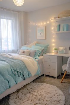 a white and blue bedroom with lights on the ceiling