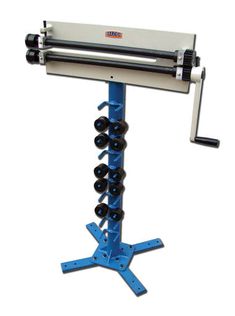 a machine that is sitting on top of a blue stand with black balls in it