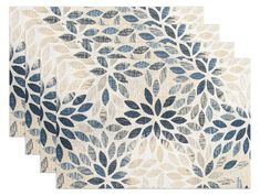 three blue and white rugs with leaves on them