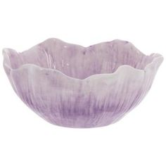 a purple glass bowl sitting on top of a white table