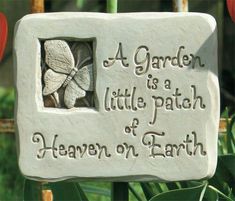 a garden is a little patch of heaven on earth sign with flowers in the background