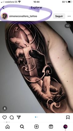 a man's arm with an artistic tattoo on it