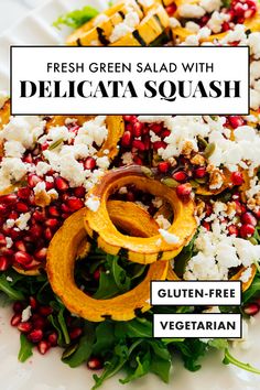 fresh green salad with delicata squash and feta cheese on a white plate