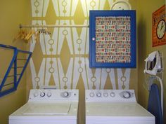 a washer and dryer sitting next to each other in front of a wall