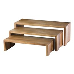 three wooden tables sitting on top of each other