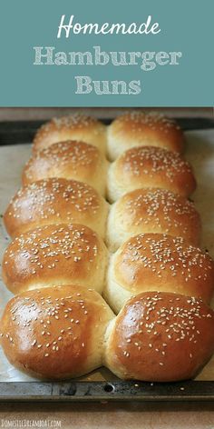 homemade hamburger buns in a baking pan with sesame seeds on top and text overlay that reads homemade hamburger buns