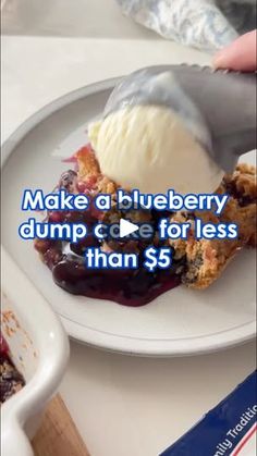 a white plate topped with blueberry dump cake