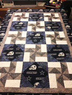 a quilted table topper with the words cowboys on it