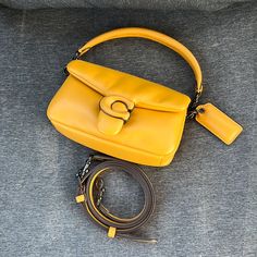 Brand New. Mini Size Never Use. Nice Yellow Color Comes With Dust Bag Yellow Coach Bag, Luxury Yellow Box Bag With Detachable Strap, Elegant Yellow Bag With Branded Hardware, Elegant Yellow Bags With Branded Hardware, Elegant Yellow Box Bag With Detachable Strap, Evening Yellow Shoulder Bag With Branded Hardware, Elegant Yellow Crossbody Flap Bag, Luxury Coach Handheld Shoulder Bag, Luxury Handheld Coach Shoulder Bag