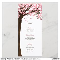 the menu card is designed to look like a tree with pink flowers on it,