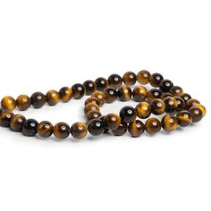 Beads measure about 8mm in diameter. These dazzling Tiger's Eye rounds show off their AA Grade quality with an excellent chatoyancy(Cat's Eye effect) and highly consistent color palette. Fans of Tiger's Eye in the traditional, smooth polished round shape should jump on these limited offerings exhibiting superior quality worthy of Jewelry Designs in bracelets, necklaces, earrings and more. Crystal Tiger Eye, Square Tiger Eye Bead Bracelet, Tiger's Eye Crystal, Tiger Eye Pendant, Tiger Eye Beads, Tiger Eye, Cat Eye, Round Beads, Color Palette