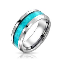 a wedding ring with blue opal inlays