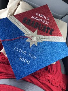 a graduation cap that says, earth's mightiest graduate i love you 30000