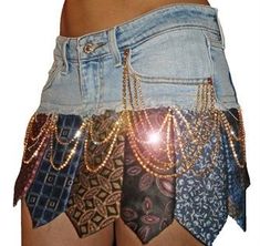 a woman's shorts with chains and beads on them, as if it were made from old jeans