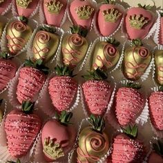 chocolate covered strawberries with pink and gold decorations