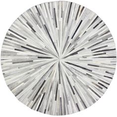 a round rug with grey and white stripes in the shape of a sunburst