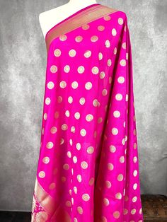 Pink Color Handmade Dupatta with Chakra design and floral design on the borders. Gold Zari Weaving. Super Light weight and very easy to carry. Can be worn with a Suit or lehenga easily. Item: DupattaBase color : Pink ColorZari Work : Muted Gold Fabric : Premium quality Banarasi Soft Silk (Non-Pure)Work : Zari Weaved with tasselsLength of the dupatta : 92 inches Width of the dupatta : 37 inches Store Policies - No return or exchange will be accepted for color variations. - No return or exchange w Cheap Festival Dupatta With Border, Luxury Silk Dupatta With Weaving Work, Cheap Festival Dupatta With Pallu, Cheap Festive Katan Silk Dupatta, Luxury Dola Silk Dupatta For Celebration, Dupatta For Lehenga, Handmade Dupatta, Chakra Design, Indian Dupatta