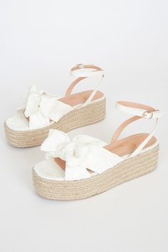 Lulus Exclusive! Give your outfit a sweet summer look with the Lulus Rayanna White Espadrille Platform Sandals! These cute sandals feature a pleated woven fabric that shapes a peep toe upper, a crisscrossing vamp with a faux bow accent, and a contrasting faux leather ankle strap with an adjustable, shiny gold buckle. A braided raffia platform heel completes the look! 2. 25" espadrille-wrapped heel. Cushioned insole. Nonskid rubber sole. Man made materials. Imported. Lulus | Rayanna White Espadri White Espadrille Sandals, White Espadrilles, Dr Shoes, Preppy Shoes, Bridal Heels, Espadrilles Platform, Shoe Inspo, Sandal Heels, Sweet Summer