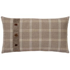 a brown and white plaid pillow with buttons on the front, sitting on a white background