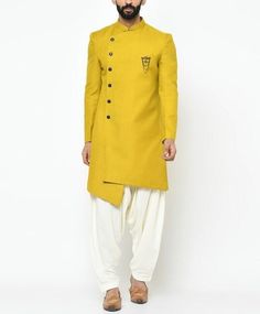 INDOWESTERN WITH SALWAR FOR MEN Soft plain indowestern sherwani with pajama Designed with a mandarin collar with buttoned front, pocket square and full sleeves. Accompanied by a pair of pajama Do Note: All Accessories shown are for styling purpose ONLY. Buttons are a part of adornment and it can vary in design. Slight color variation may occur due to photographic reasons. * Blazer Features Semi Padded shoulder for a formal silhouette Stand Mandarin Collar Boat-shaped breast pocket Half-canvas construction * Pattern: solid * Limited quantity, Seasonal collection. We change our fashion very frequently. Grab it before it disappears. * Medium to Heavy weight fabric. Made for all climates. **VISIT OUR ETSY STORE FOR MORE PRODUCTS** WE HAVE COLLECTION FOR WEDDING SUIT, COCKTAIL PARTY SUIT, BEACH Traditional Salwar Kameez With Gota Work For Formal Occasions, Fitted Gota Work Kurta For Wedding, Wedding Bandhgala With Gota Work And Traditional Drape, Wedding Bandhgala With Gota Work, Yellow Unstitched Suit With Naqshi For Wedding, Unstitched Gota Work Sherwani For Wedding, Eid Bandhgala For Groom With Straight Kurta, Wedding Nehru Jacket With Gota Work For Eid, Traditional Sherwani With Gota Work For Eid