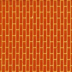 an orange tiled wall with small squares on it