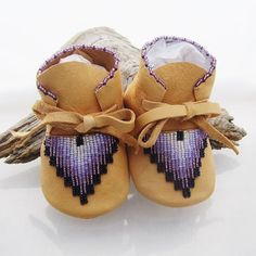 "One of a kind keepsake gift for that precious little one. Premium quality baby shoes that can be passed down for generations. The material is an incredibly soft supple deer hide that will stretch to fit your baby's foot as she grows. Deerskin is more breathable than cow-hide and vinyl for the ultimate in comfort. The seams are machine sewn for strength and durability, then trimmed and flatten to avoid irritation and rubbing. Soft soled shoes are ideal for babies that are learning to walk, they Beaded Baby Moccasins, Baby Moccasin Pattern, Heirloom Baby Gifts, Native American Moccasins, Moccasin Pattern, Beaded Moccasins, Deer Hide, Baby Shower Presents, Native American Beadwork