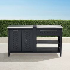 the sideboard is made out of black wood and has two drawers on each side