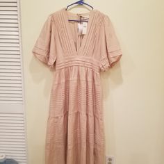 This Is A Beautiful And Brand New Blush Pink Dress From Anthropologie. It Is A Size Large Which I No Longer Fit In. Please Note: The Zipper Gets Stuck If Pulled Down All The Way (See Last Two Pics) But Looks Completely Fine Once Pulled Back Up. Beige V-neck Lined Midi Dress, V-neck Lined Midi Dress For Dress Down Occasions, Beige Lined V-neck Midi Dress, Beige Lined Midi Dress With V-neck, Beige Lined Maxi Dress, Beige Maxi Dress Lined, Beige Lined Midi Dress, Feminine Short Sleeve Lined Midi Dress, Beige Short Sleeve Maxi Dress For Date Night