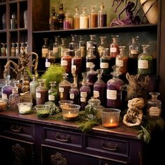 an assortment of spices and herbs on display in a cabinet with candles, jars and other items