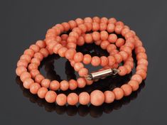 SALMON CORAL NECKLACE; gold clasp, single strand vintage genuine coral, natural Coral beads FREE SHIPPING. See specifications below. This lovely vintage Coral necklace is from the 1950s. It has untreated natural Salmon Coral round beads. The beads are slightly graduated. The necklace has a 9k gold tube clasp which is stamped. The Coral is threaded onto a type of plastic wire which is unbreakable.  You can clearly see the growth lines in the Coral and as it is natural that the beads are not all p Coral Jewelry Vintage, Coral Jewellery, Coral Beads Necklace, Silver Belt Buckle, Natural Coral, Coral Necklace, Coral Jewelry, Photo Locket, Antique Necklace