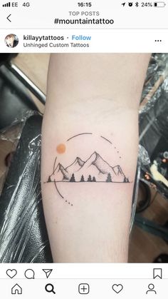 a mountain tattoo on the arm