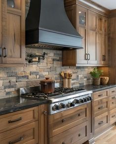 a stove top oven sitting inside of a kitchen next to wooden cabinets and counter tops