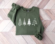 Christmas Tree Sweatshirt for Women, Christmas Shirt, Winter Sweatshirt, Christmas Crewneck, Holiday Sweaters, Women Christmas Shirts, Holiday Gifts, Funny Christmas Sweater, Xmas Shirt -Our shirts are made to order specially for you. Because of this reason we don't accept returns or exchanges. Please check our color and size charts before you place your order. If you have any questions please send us a message to clarify sizing or colors. ###Product Information### Solid colors such as black, wh Minimal Sweatshirt, Holiday Sweaters, Merry Bright Christmas, Christmas Tree Shirt, Winter Shirts, Christmas Outfits, Holiday Sweatshirt, Tree Shirt, Christmas Tree Farm