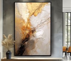 an abstract painting hangs on the wall above a fireplace