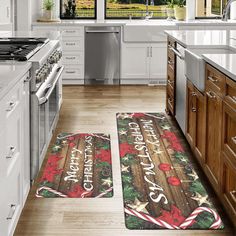 two christmas themed kitchen mats on the floor in front of an oven and stove top