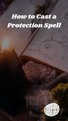 an open book with the words how to cast a protection spell on it and a lit candle