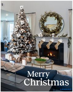 a living room with a christmas tree and fireplace