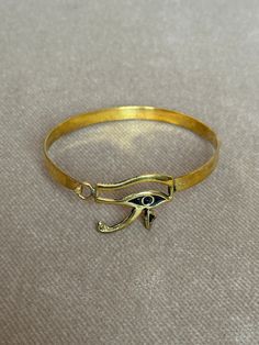 If You Can't Stop Thinking About ItBUY IT ;) Eye of Horus, in ancient Egypt, a symbol representing protection, health, and restoration. According to Egyptian myth, Horus lost his left eye in a struggle with Seth. The eye was magically restored by Hathor, and this restoration came to symbolize the process of making whole and healing. For this reason, the symbol was often used in amulets. Visit https://www.etsy.com/shop/egyptoriginals  for more handcrafted Ancient Egyptian Art Sculpture statues Spiritual Bangle Bracelets For Blessing, Symbolic Bronze Jewelry, Symbolic Bronze Ceremonial Jewelry, Adjustable Symbolic Cuff Bracelet, Ceremonial Symbolic Bronze Jewelry, Spiritual Gold Bangle Bracelet As Gift, Handmade Symbolic Jewelry, Nickel Free Symbolic Ceremonial Jewelry, Amulet Bracelet Jewelry As Gift