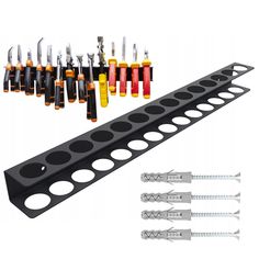 an assortment of screwdrives and other tools are arranged on a rack for display