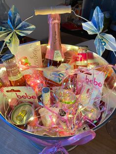 a basket filled with lots of different types of drinks and condiments on top of a table